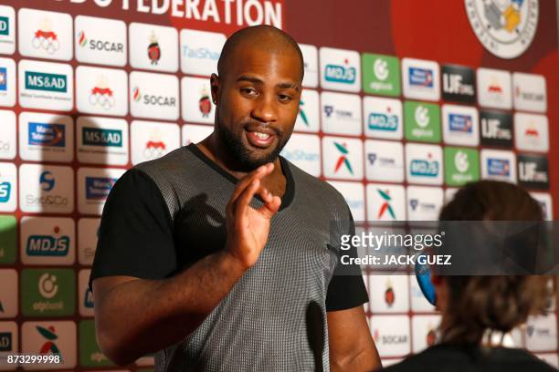 French judoka Teddy Riner answers journalists questions after his victory in the Judo World Championships Open in Marrakesh on November 12, 2017. -...