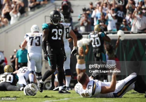 Tashaun Gipson of the Jacksonville Jaguars looks at Philip Rivers of the Los Angeles Chargers on the field during the first half of their game at...