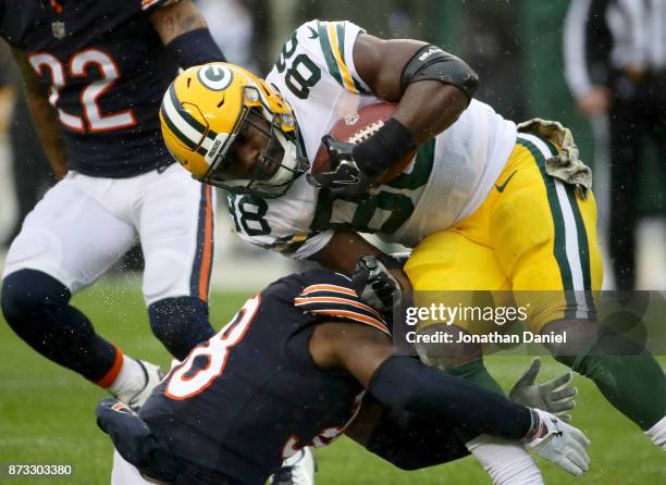 Adrian Amos of the Chicago Bears hits Ty Montgomery of the Green Bay Packers in the first quarter at Soldier Field on November 12, 2017 in Chicago,...