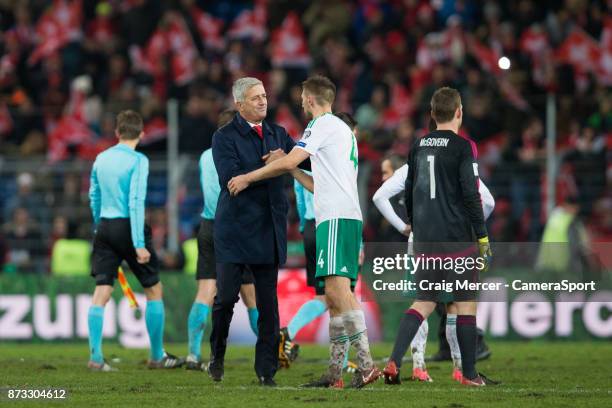 Switzerlands Head Coach Vladimir Petkovic embraces Northern Irelands Gareth McAuley after the FIFA 2018 World Cup Qualifier Play-Off: Second Leg...