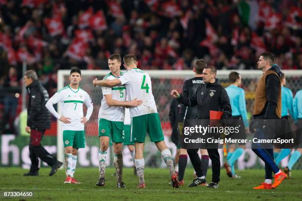 Northern Ireland's Jonny Evans embraces team mate Gareth McAuley after the FIFA 2018 World Cup Qualifier Play-Off: Second Leg between Switzerland and...