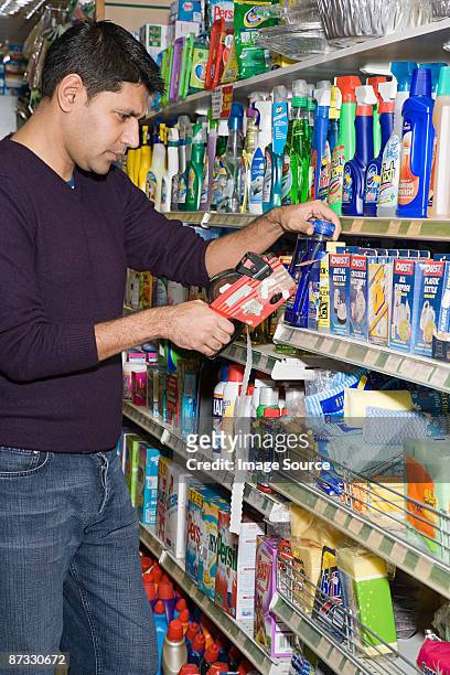 man in shop with price gun - labeling data stock pictures, royalty-free photos & images
