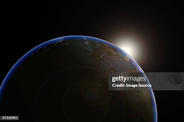 sun emerging over planet earth - wonderlust2015 stock pictures, royalty-free photos & images