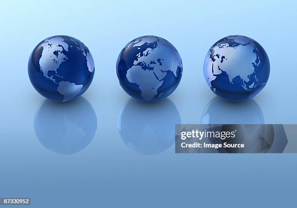 three globes in a row - small group of objects stock pictures, royalty-free photos & images