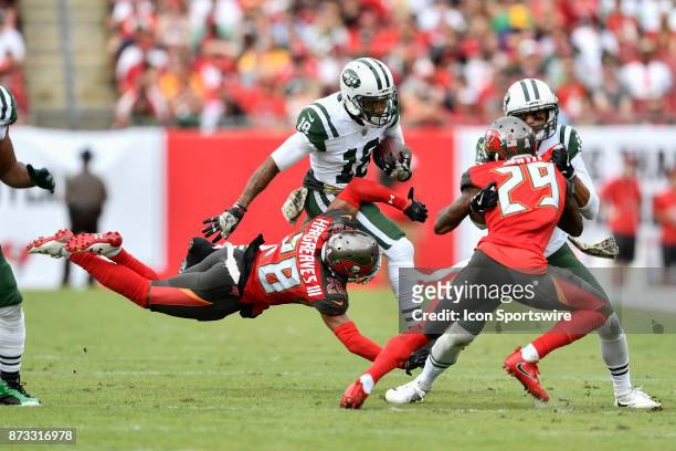 New York Jets wide receiver ArDarius Stewart is tackled by a diving Tampa Bay Buccaneers cornerback Vernon Hargreaves III on the jet sweep during the...