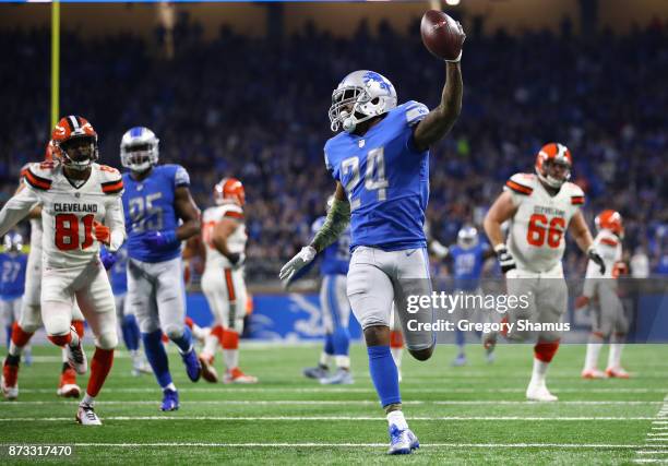 Nevin Lawson of the Detroit Lions recovers a fumble and runs it back for a touchdown against the Cleveland Browns during the second quarter at Ford...