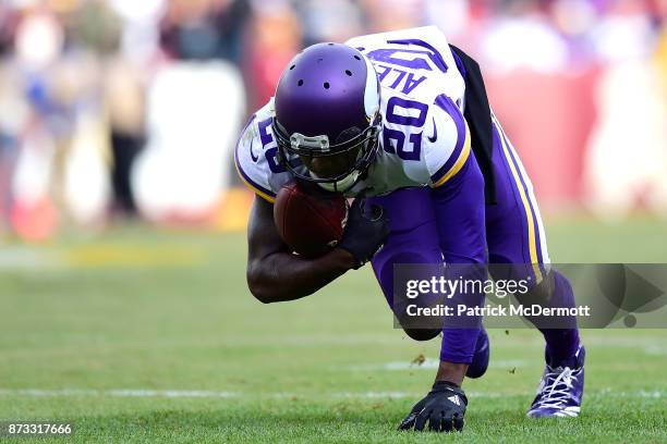 Cornerback Mackensie Alexander of the Minnesota Vikings intercepts the ball during the second quarter against the Washington Redskins at FedExField...