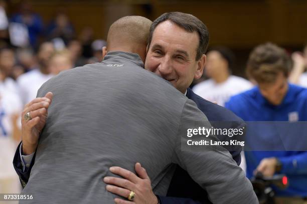 Former Duke basketball player Shane Battier hugs head coach Mike Krzyzewski of the Duke Blue Devils following their 99-69 win against the Utah Valley...