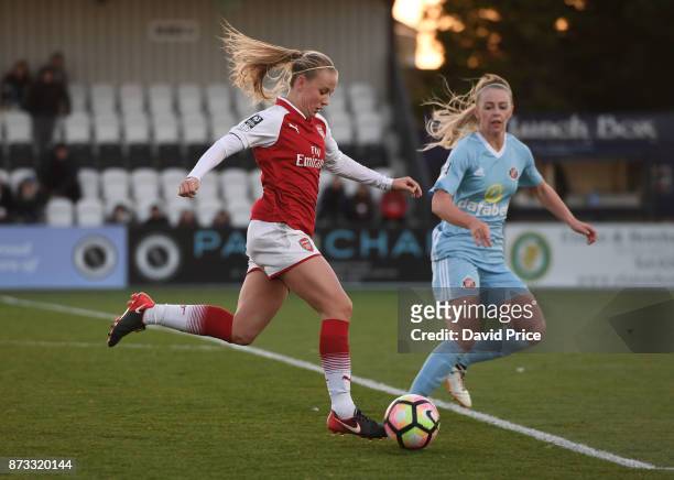 Beth Mead of Arsenal takes on Hayley Sharp of Sunderland during the WSL match between Arsenal Women and Sunderland on November 12, 2017 in...