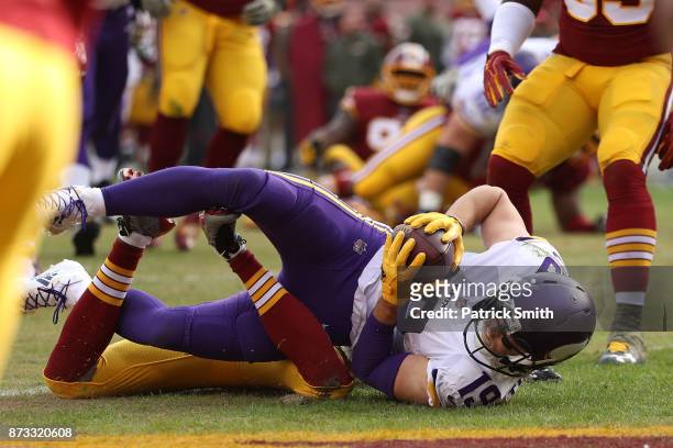 Wide receiver Adam Thielen of the Minnesota Vikings makes a touchdown catch during the second quarter against the Washington Redskins at FedExField...