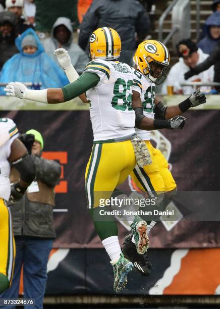 Ty Montgomery and Richard Rodgers of the Green Bay Packers celebrate after Montgomery scored a touchdown in the second quarter against the Chicago...
