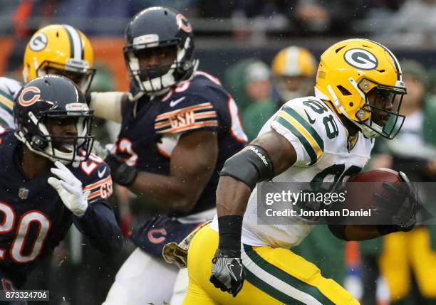 Ty Montgomery of the Green Bay Packers carries the football past Prince Amukamara of the Chicago Bears in the second quarter at Soldier Field on...