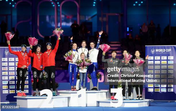 The team of Norway with Anne Gulbrandsen, Hege Boekko and Ida Njatun poses during the medal ceremony after winning the 2nd place, the team of Russia...