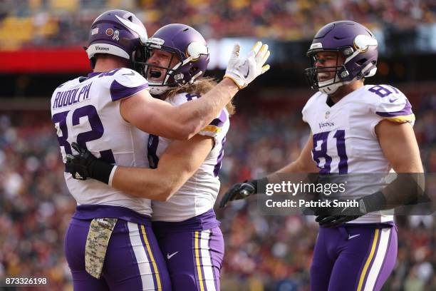 Tight end David Morgan of the Minnesota Vikings celebrates with tight end Kyle Rudolph of the Minnesota Vikings after scoring a touchdown during the...