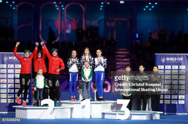 The team of Norway with Anne Gulbrandsen, Hege Boekko and Ida Njatun poses during the medal ceremony after winning the 2nd place, the team of Russia...