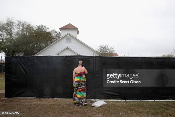 Woman visits the First Baptist Church of Sutherland Springs on November 12, 2017 in Sutherland Springs, Texas. The congregation held service today in...
