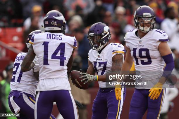 Wide receiver Jarius Wright of the Minnesota Vikings celebrates with teammates after a touchdown during the third quarter against the Washington...