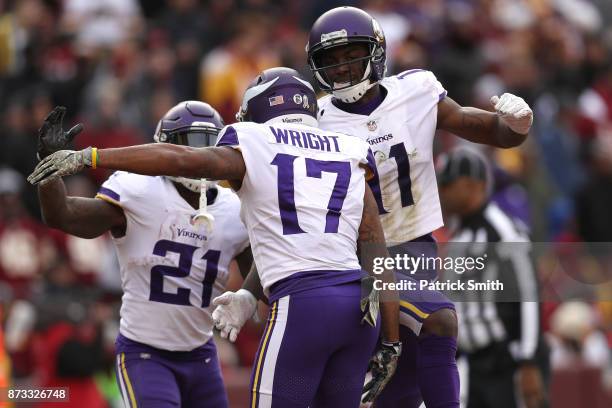 Wide receiver Jarius Wright of the Minnesota Vikings celebrates with teammates after a touchdown during the third quarter against the Washington...