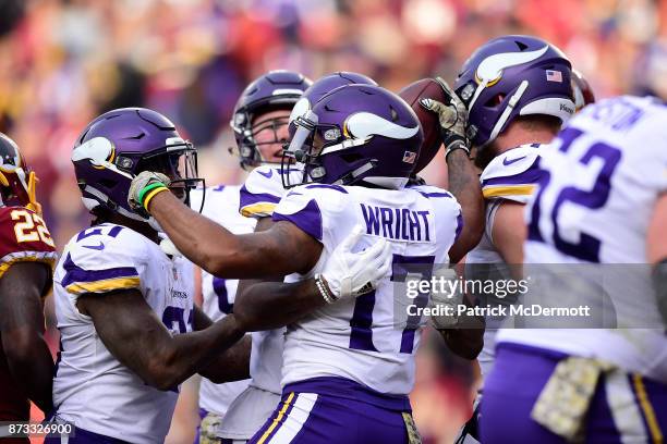 Wide receiver Jarius Wright of the Minnesota Vikings celebrates with teammates after a touchdown during the third quarter against the Washington...