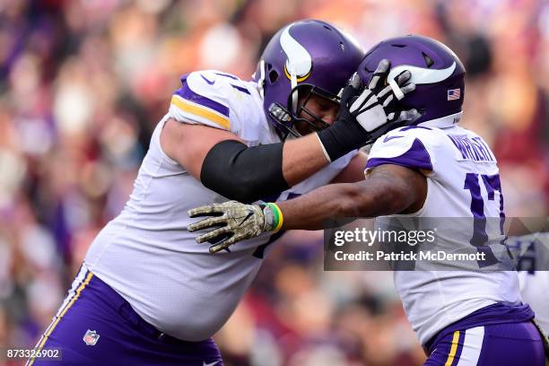 Wide receiver Jarius Wright of the Minnesota Vikings celebrates with teammates after a touchdown during the third quarter against the Washington...