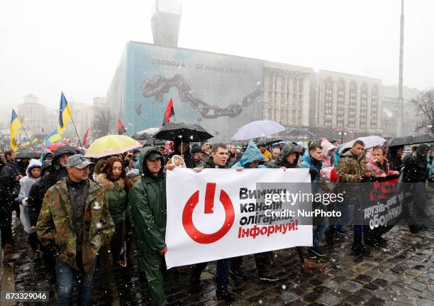 Ukrainians take part in the &quot;March of outraged&quot; in Kiev, Ukraine, 12 November, 2017. Activists set up a tent camp in front of Parliament on...