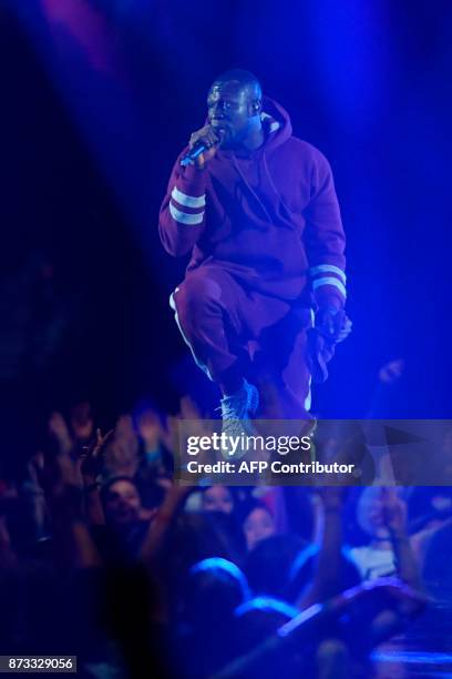 British grime and hip hop artist Stormzy performs during the 2017 MTV Europe Music Awards at Wembley Arena in London on November 12, 2017. / AFP...