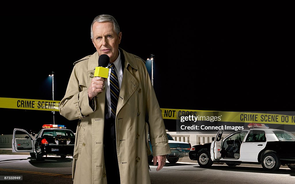 News presenter at crime scene