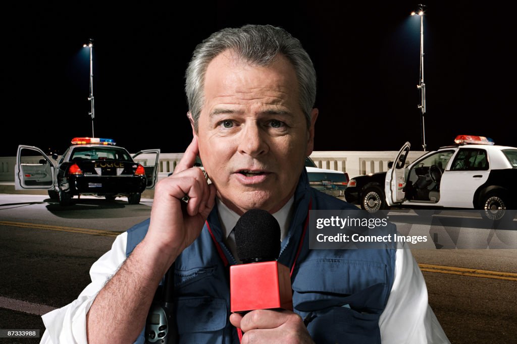 News presenter at crime scene