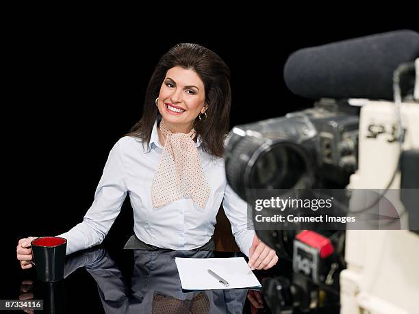 news presenter and camera - backcombed stock pictures, royalty-free photos & images