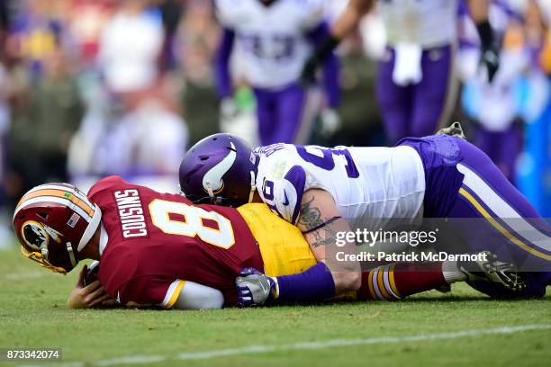 Defensive end Brian Robison of the Minnesota Vikings sacks quarterback Kirk Cousins of the Washington Redskins during the third quarter at FedExField...