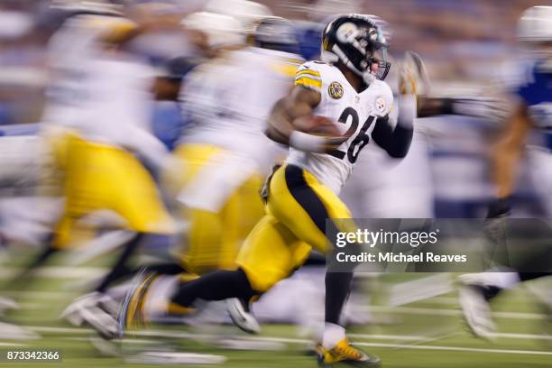 Le'Veon Bell of the Pittsburgh Steelers runs with the ball against the Indianapolis Colts during the first half at Lucas Oil Stadium on November 12,...