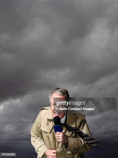 news presenter in storm - weather forecaster stock pictures, royalty-free photos & images
