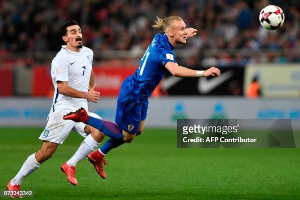 Croatia's Domagoj Vida vies with Greece's Lazaros Christodoulopoulos during the World Cup 2018 play-off football match Greece vs Croatia, on November...