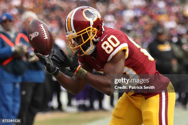 Wide receiver Jamison Crowder of the Washington Redskins attempts to make a catch during the fourth quarter against the Minnesota Vikings at...