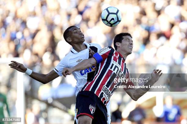 Madson of Vasco da Gama struggles for the ball with Hernanes of Sao Paulo during the match between Vasco da Gama and Sao Paulo as part of Brasileirao...