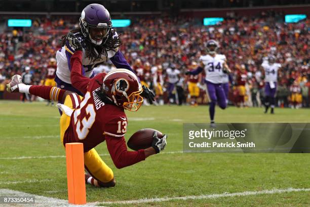 Wide receiver Maurice Harris of the Washington Redskins catches a touchdown pass in front of cornerback Trae Waynes of the Minnesota Vikings during...