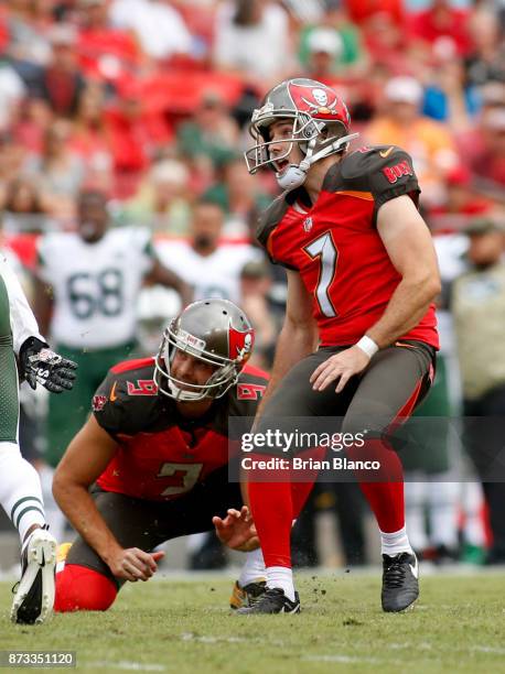 Kicker Patrick Murray of the Tampa Bay Buccaneers and punter Bryan Anger watch the path of Murray's 49-yard field goal during the third quarter of an...