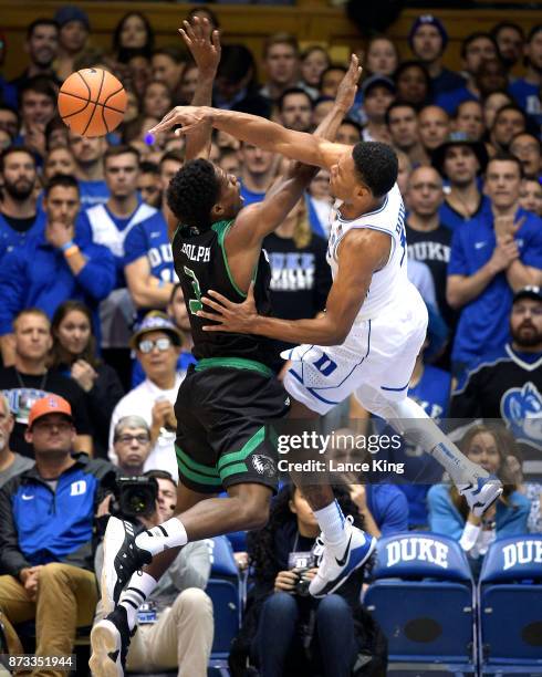 Trevon Duval of the Duke Blue Devils defends a shot by Brandon Randolph of the Utah Valley Wolverines at Cameron Indoor Stadium on November 11, 2017...