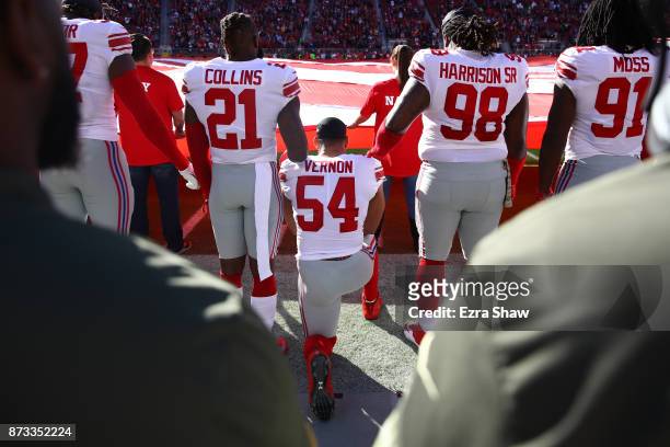 Olivier Vernon of the New York Giants kneels during the national anthem prior to their NFL game against the San Francisco 49ers at Levi's Stadium on...