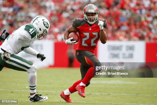 Running back Doug Martin of the Tampa Bay Buccaneers avoids cornerback Buster Skrine of the New York Jets during a carry in the third quarter of an...