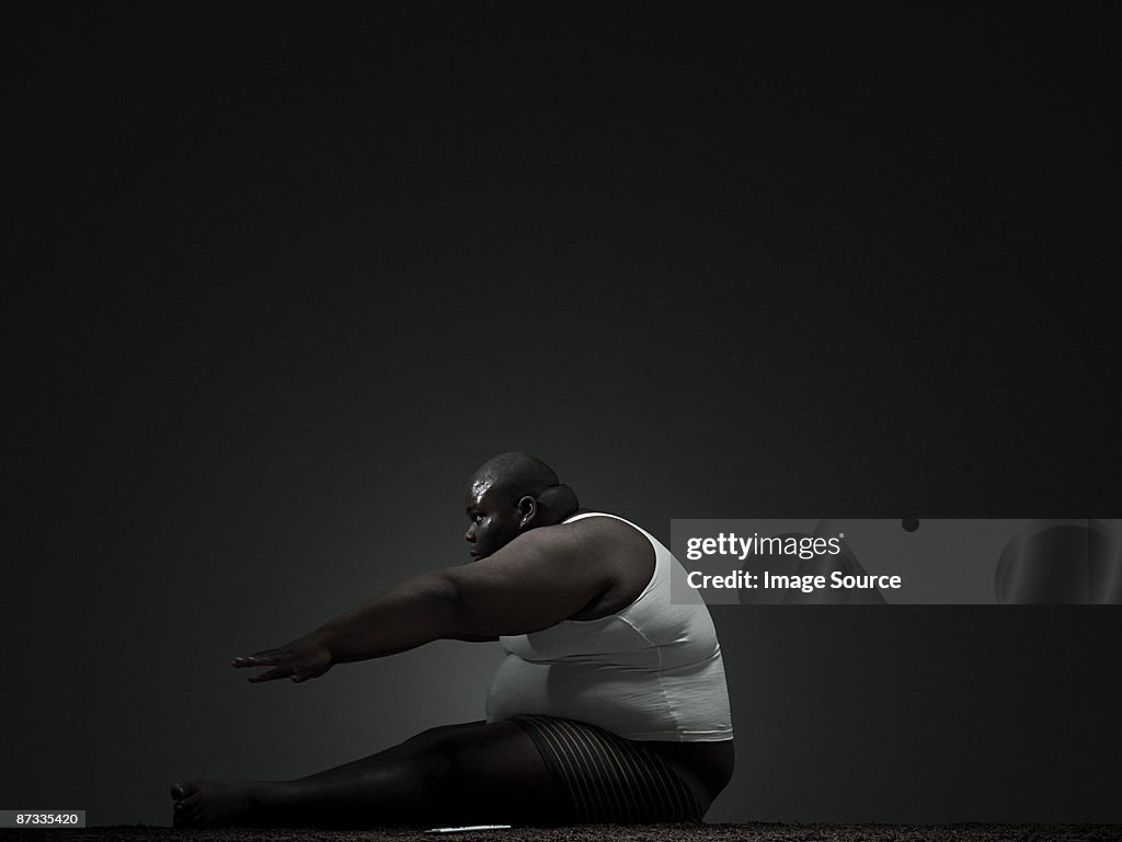 Overweight man doing sit up