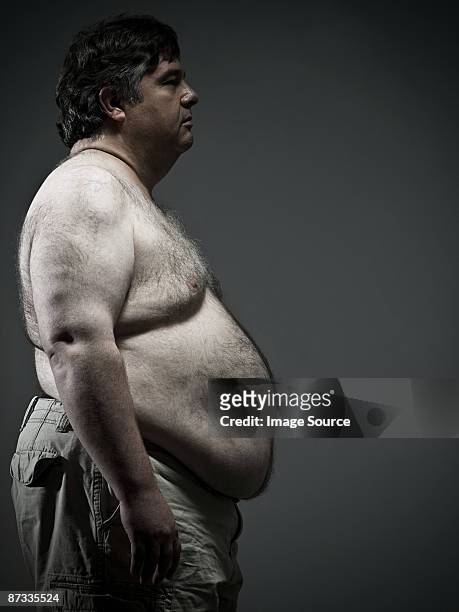 profile of overweight man - hairy chest stock-fotos und bilder