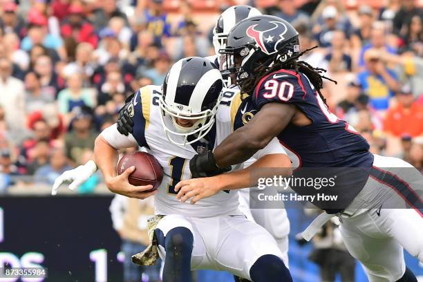 Jadeveon Clowney of the Houston Texans sacks Jared Goff of the Los Angeles Rams during the first half at the Los Angeles Memorial Coliseum on...