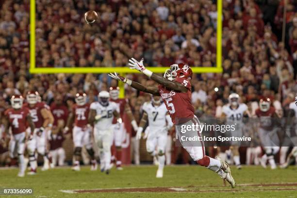 Wide receiver Marquise Brown of the Oklahoma Sooners reaches for the pass during the Oklahoma Sooners and the Texas Christian University Horned Frogs...