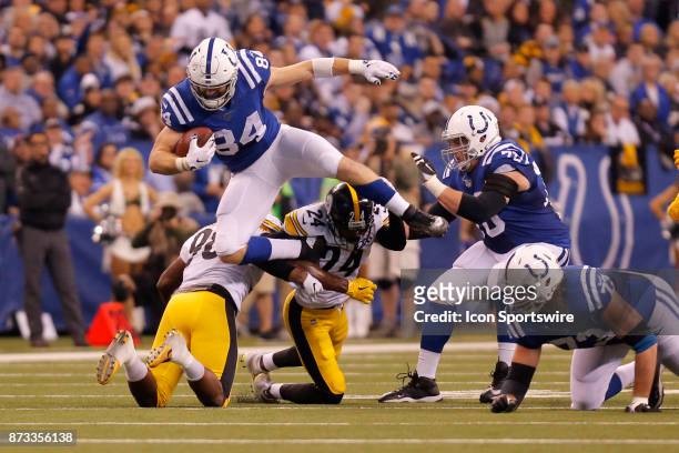 November 12: Indianapolis Colts tight end Jack Doyle tries to jump over Pittsburgh Steelers linebacker Vince Williams and Pittsburgh Steelers corner...