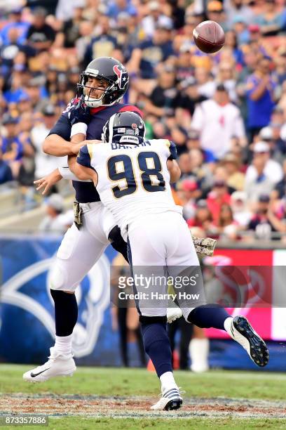 Connor Barwin of the Los Angeles Rams sacks Tom Savage of the Houston Texans during the first half of the game at the Los Angeles Memorial Coliseum...