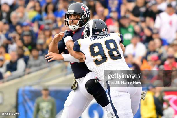 Connor Barwin of the Los Angeles Rams sacks Tom Savage of the Houston Texans during the first half of the game at the Los Angeles Memorial Coliseum...