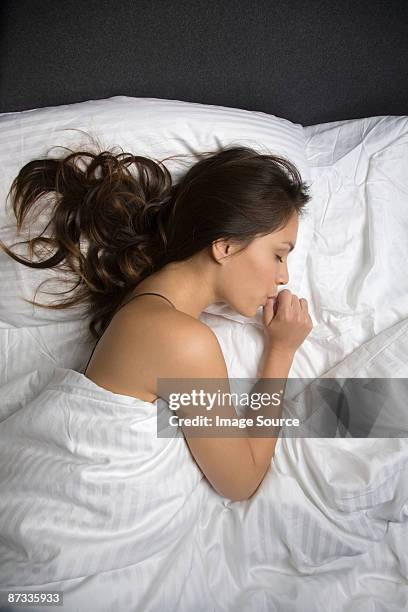 a woman sleeping - woman thumb stock pictures, royalty-free photos & images