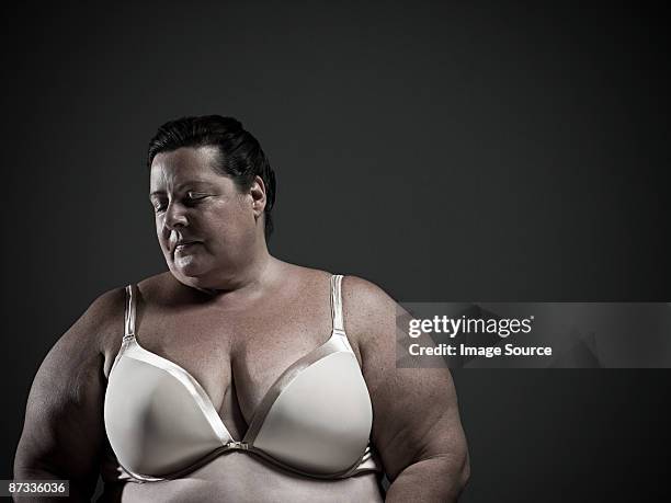 woman wearing a brassiere - große brüste stock-fotos und bilder