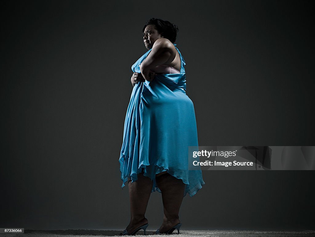 Woman struggling with dress